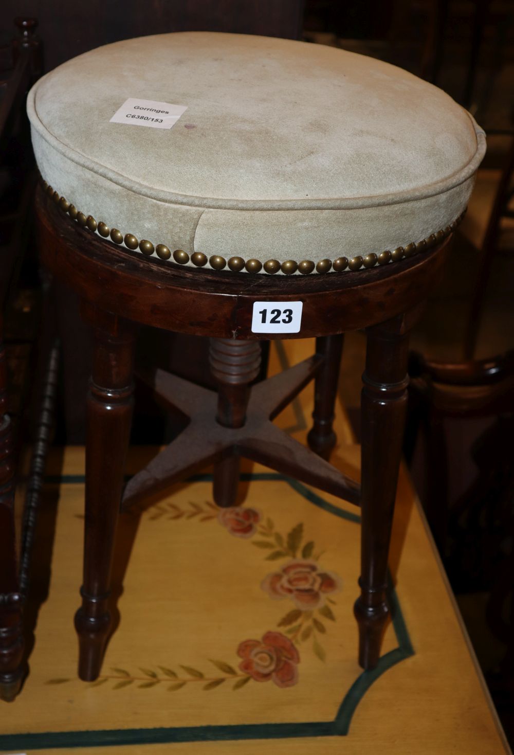 A Regency mahogany circular adjustable piano stool, 32cm diameter, H.48cm